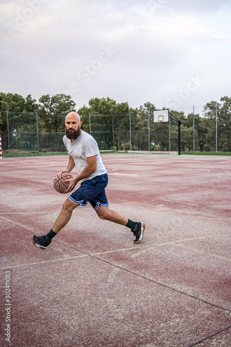Young basketball player running with the ball