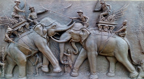 statues in Thai temple,Thai art is unique...Fighting a war elephant in ancient times.