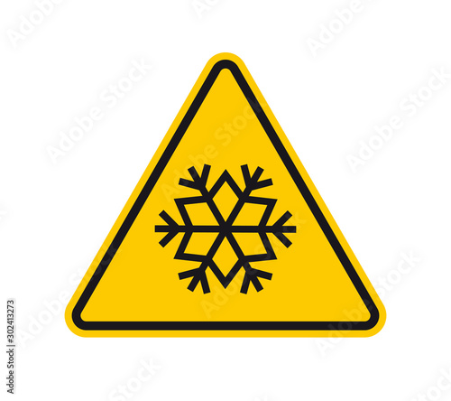 Vector yellow triangle sign - black silhouette snowflake. Isolated on white background.