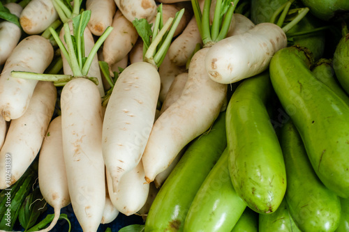White radish and Green eggplant for sell in the fresh market.