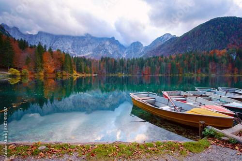 Alpine lake and colorful boats, Lake Fusine,Italy