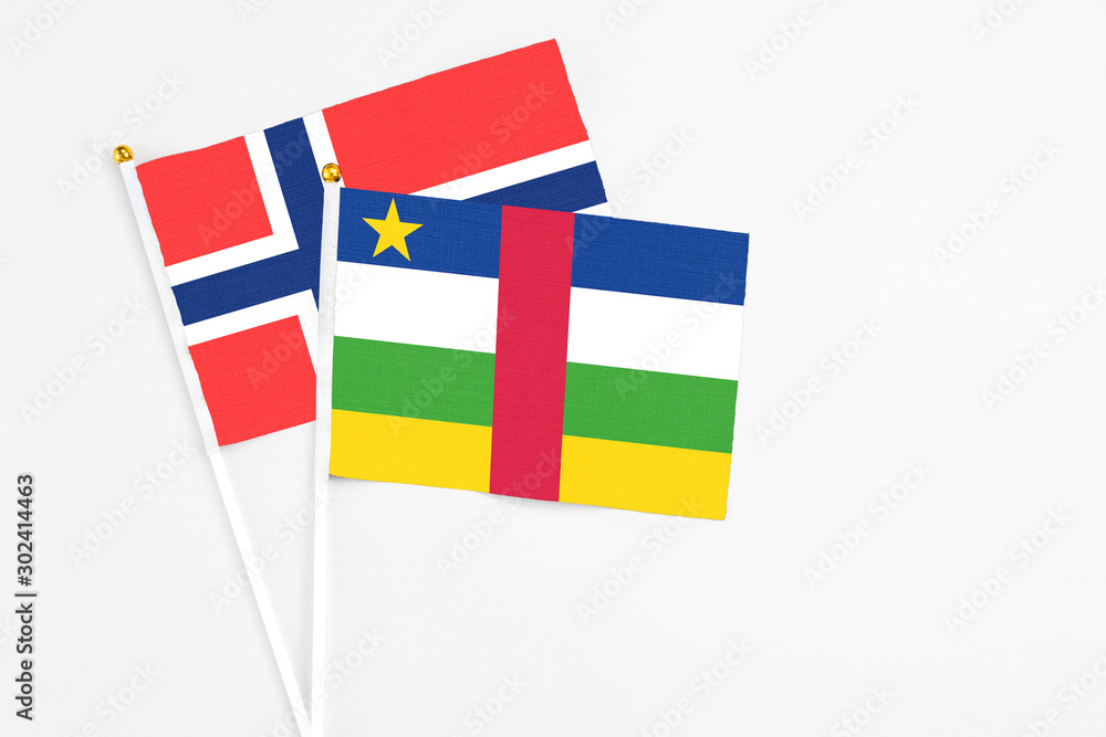 Central African Republic and Bouvet Islands stick flags on white background. High quality fabric, miniature national flag. Peaceful global concept.White floor for copy space. Central African Republic and Bouvet Islands stick flags on white background. High quality fabric, miniature national flag. Peaceful global concept.White floor for copy space.