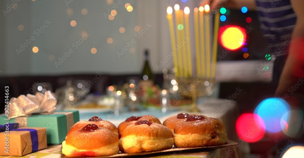 Jewish Festival of Lights. Sufganiyah is a round jelly doughnut eaten in Israel and around the world on the Jewish