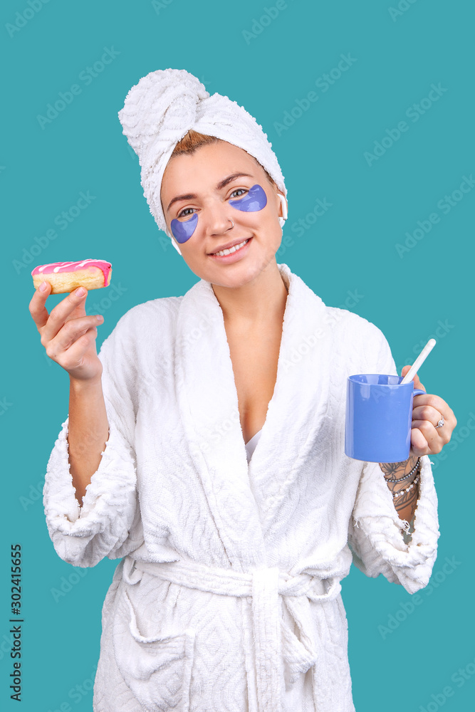 blonde girl in a bathrobe and with patches on her face blonde girl in a bathrobe and with patches on her face