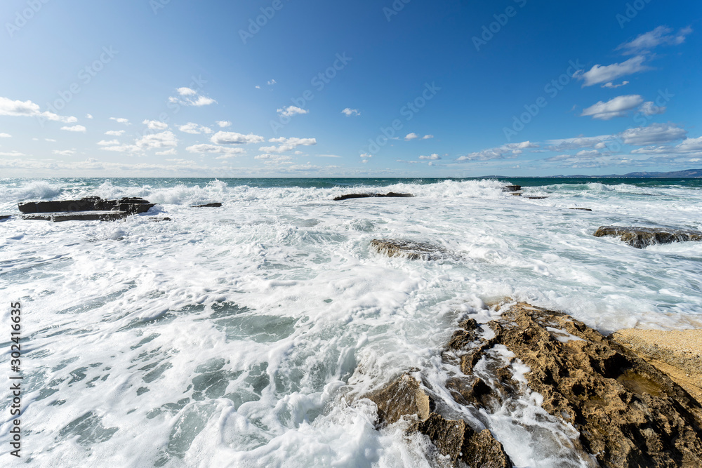 Water in the form of waves of the Mediterranean Sea on the Island of Mallorca, Spain