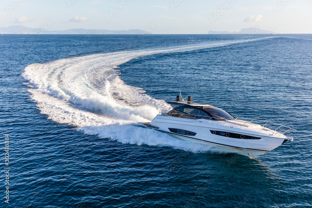 luxury motor yacht in navigation, aerial view - obrazy, fototapety, plakaty 