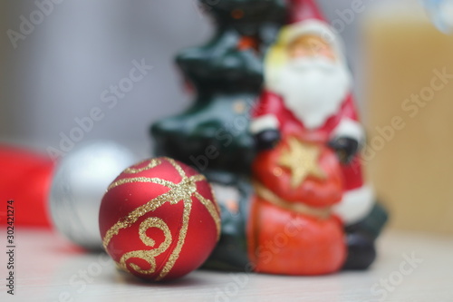 Bright colorful Christmas-tree decorations in white and red tones create a fabulous sensation of Christmas and New Year.