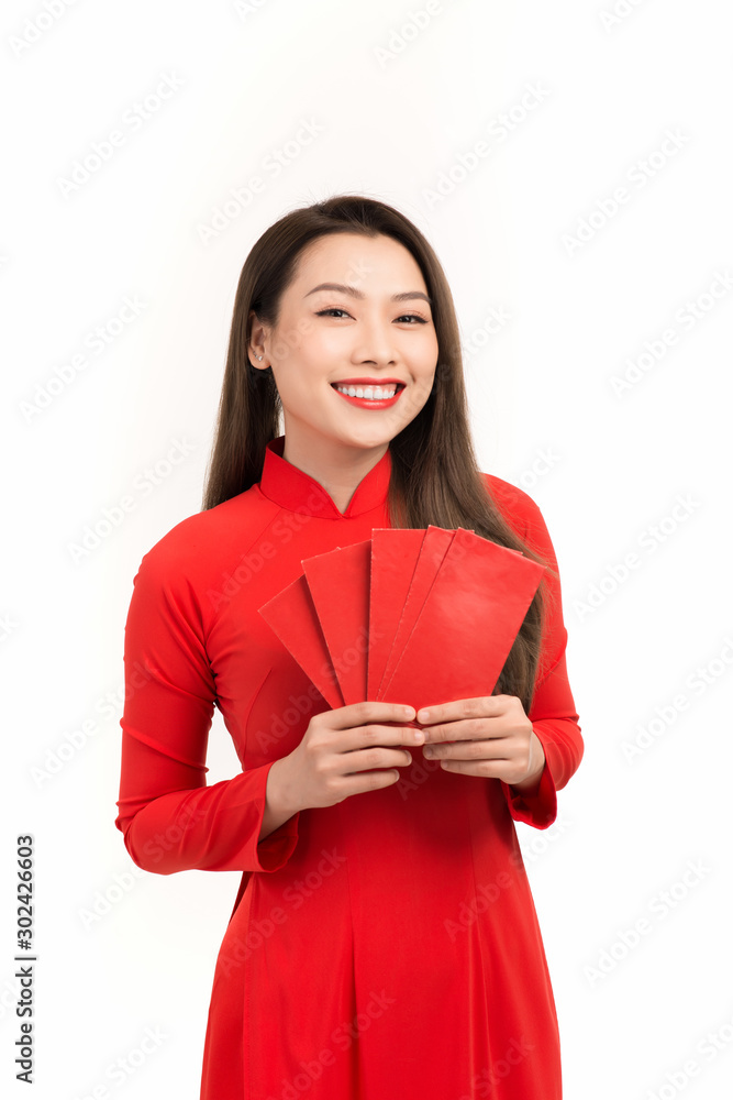 Vietnamese woman in red ao dai dress smile. Happy lunar new year concept Vietnamese woman in red ao dai dress smile. Happy lunar new year concept