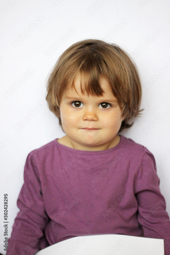 Portrait of a cute baby with brown eyes Portrait of a cute baby with brown eyes
