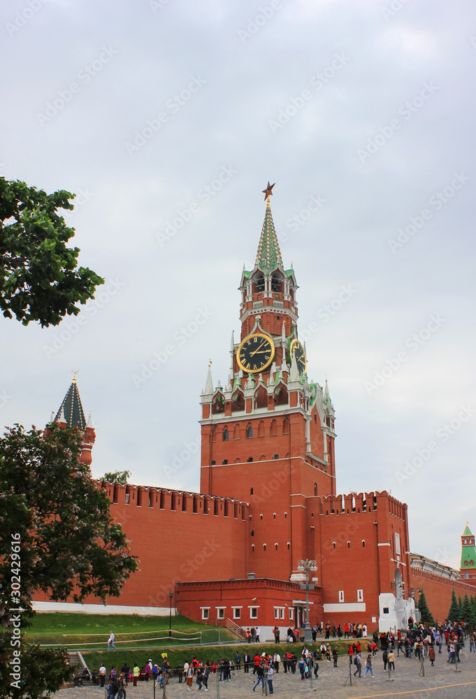 Kremlin on the Red Square in Moscow, Russia. Close up of Spasskaya Tower architecture on cloudy summer day Kremlin on the Red Square in Moscow, Russia. Close up of Spasskaya Tower architecture on cloudy summer day