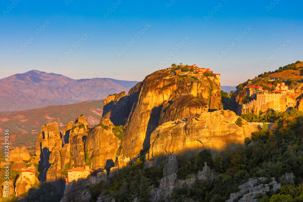 Fototapeta premium Landscape with monasteries and rock formations in Meteora, Greece. during the sunrise