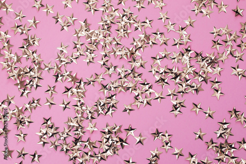 small golden stars on pink background