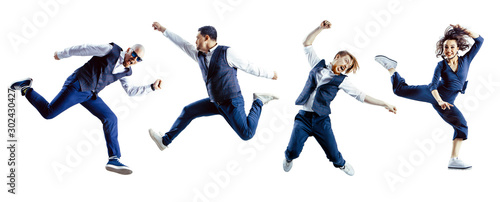 A group of excited jumping students isolated on white background.