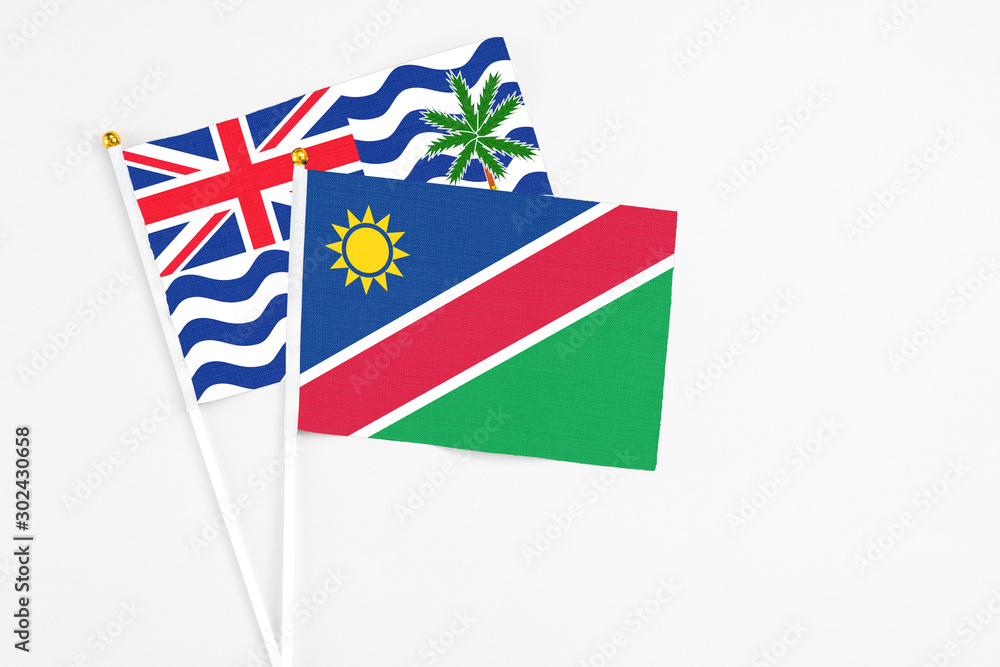 Namibia and British Indian Ocean Territory stick flags on white background. High quality fabric, miniature national flag. Peaceful global concept.White floor for copy space. Namibia and British Indian Ocean Territory stick flags on white background. High quality fabric, miniature national flag. Peaceful global concept.White floor for copy space.