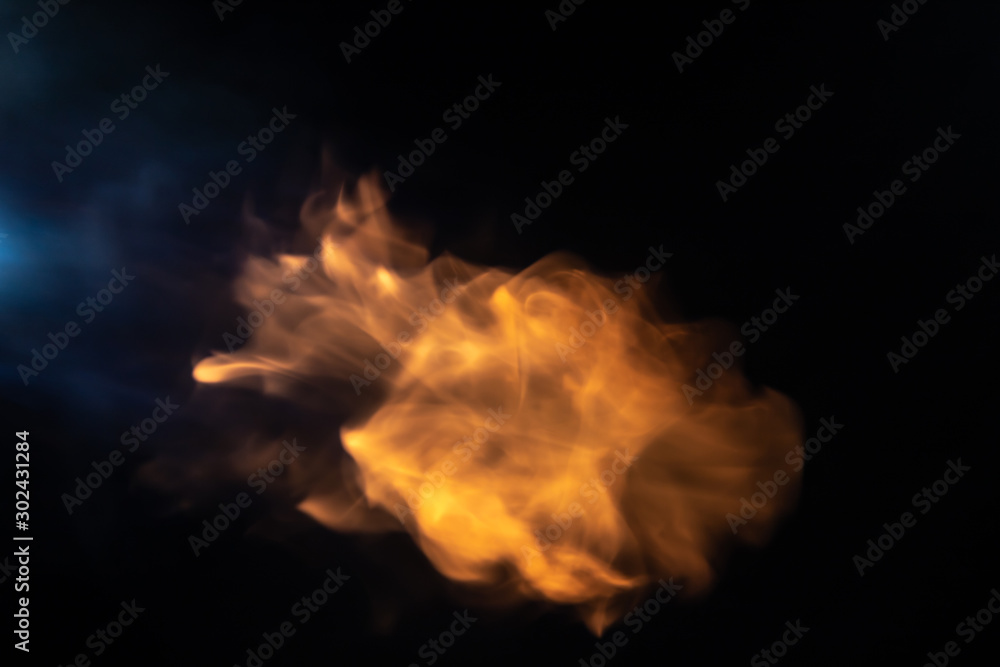 Throw soft blur flame with blue flame from the left side on black background. For overlay effect