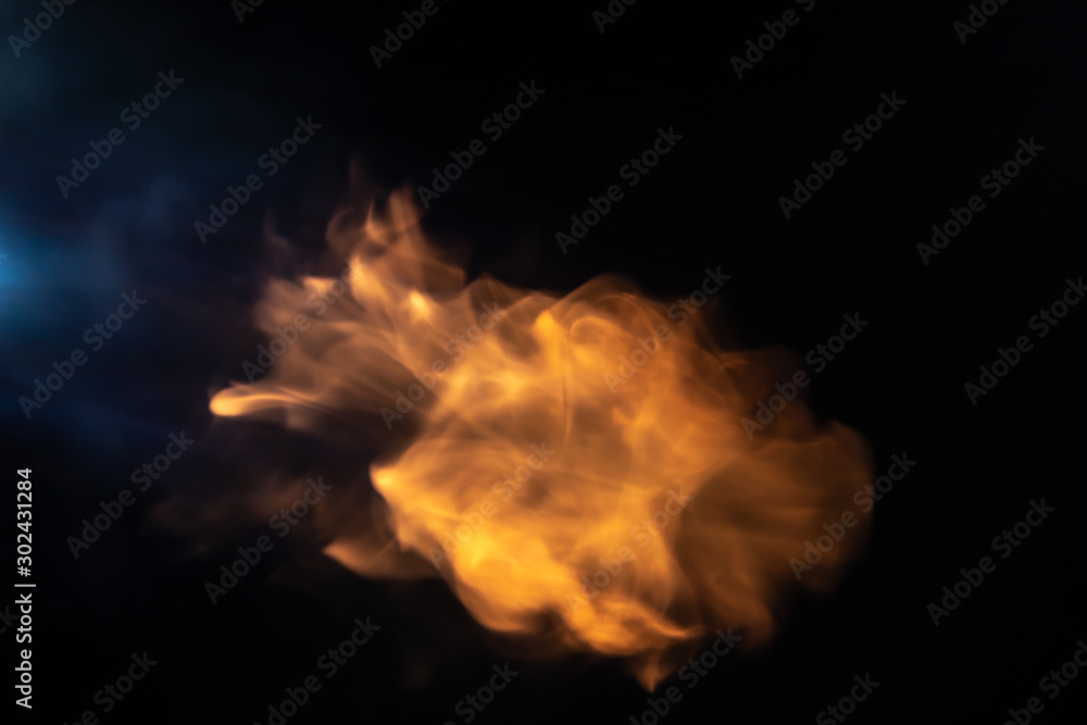 Throw soft blur flame with blue flame from the left side on black background. For overlay effect Throw soft blur flame with blue flame from the left side on black background. For overlay effect