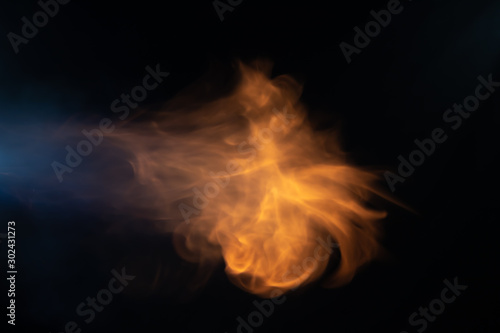 Throw soft blur flame with blue flame from the left side on black background. For overlay effect