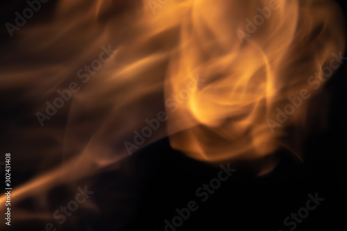 Soft blur flame like fire ball on black background. For overlay effect