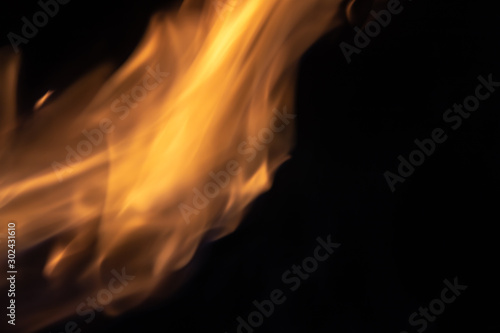 Soft blur flame with soft detail moving to the top on black background. For overlay effect