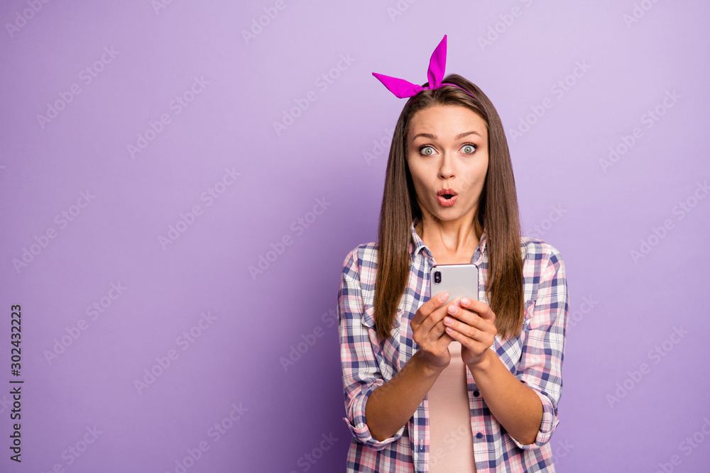 Wow blog repost. Portrait of impressed girl use her cellphpone get social media notification read news comments scream omg wear good look outfit isolated violet color background Wow blog repost. Portrait of impressed girl use her cellphpone get social media notification read news comments scream omg wear good look outfit isolated violet color background
