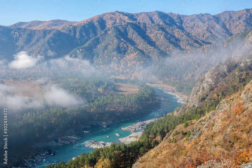 Fog in the Katun river valley, view from the top. Autumn Altai.