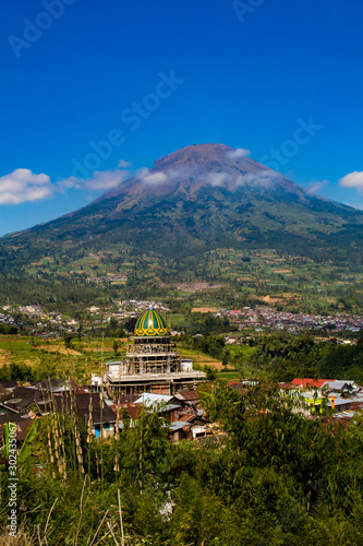 Wallpaper Mural Peaceful small town surrounded by mountains and beautiful blue sky Torontodigital.ca