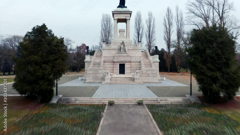 Budapest, Hungary, Flying over Kerepesi Cemetery by Drone in autumn, golden and brown leaves, hazy, foggy weather. Statue of Lajos Kossuth mausoleum Budapest, Hungary, Flying over Kerepesi Cemetery by Drone in autumn, golden and brown leaves, hazy, foggy weather. Statue of Lajos Kossuth mausoleum