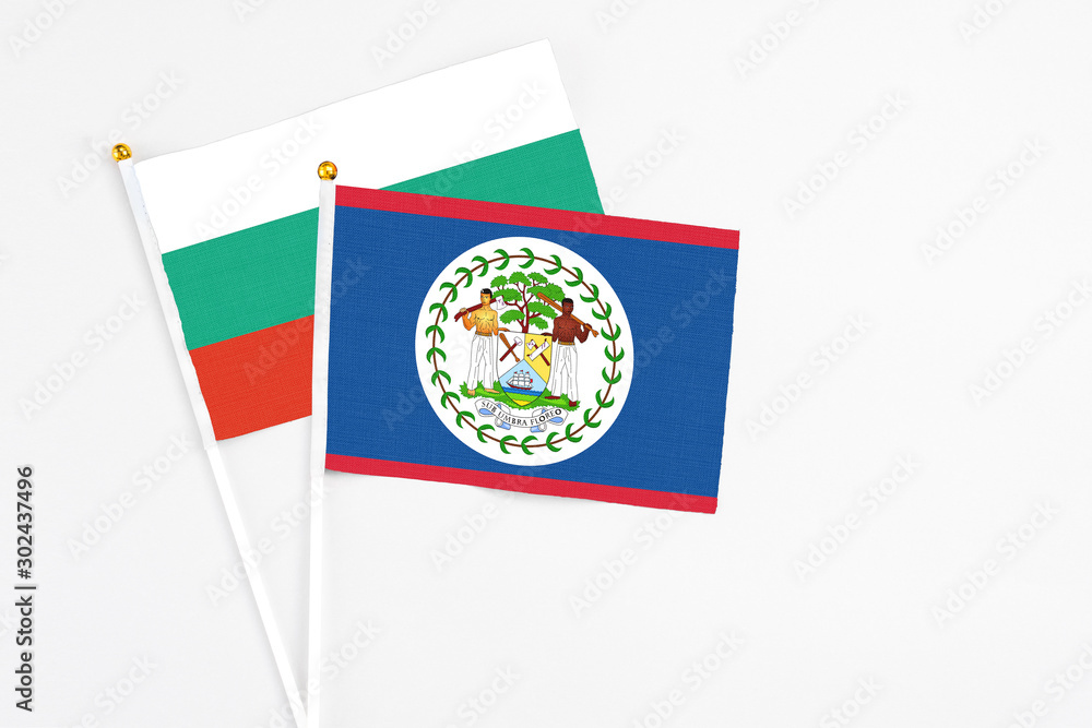 Belize and Bulgaria stick flags on white background. High quality fabric, miniature national flag. Peaceful global concept.White floor for copy space. Belize and Bulgaria stick flags on white background. High quality fabric, miniature national flag. Peaceful global concept.White floor for copy space.