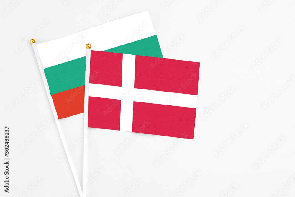 Denmark and Bulgaria stick flags on white background. High quality fabric, miniature national flag. Peaceful global concept.White floor for copy space.