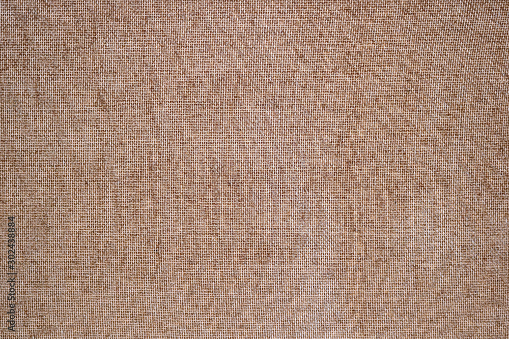 brown canvas surface - rough fabric material texture in a blank background brown canvas surface - rough fabric material texture in a blank background