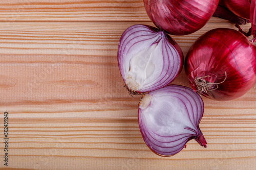 red onions on rustic wood