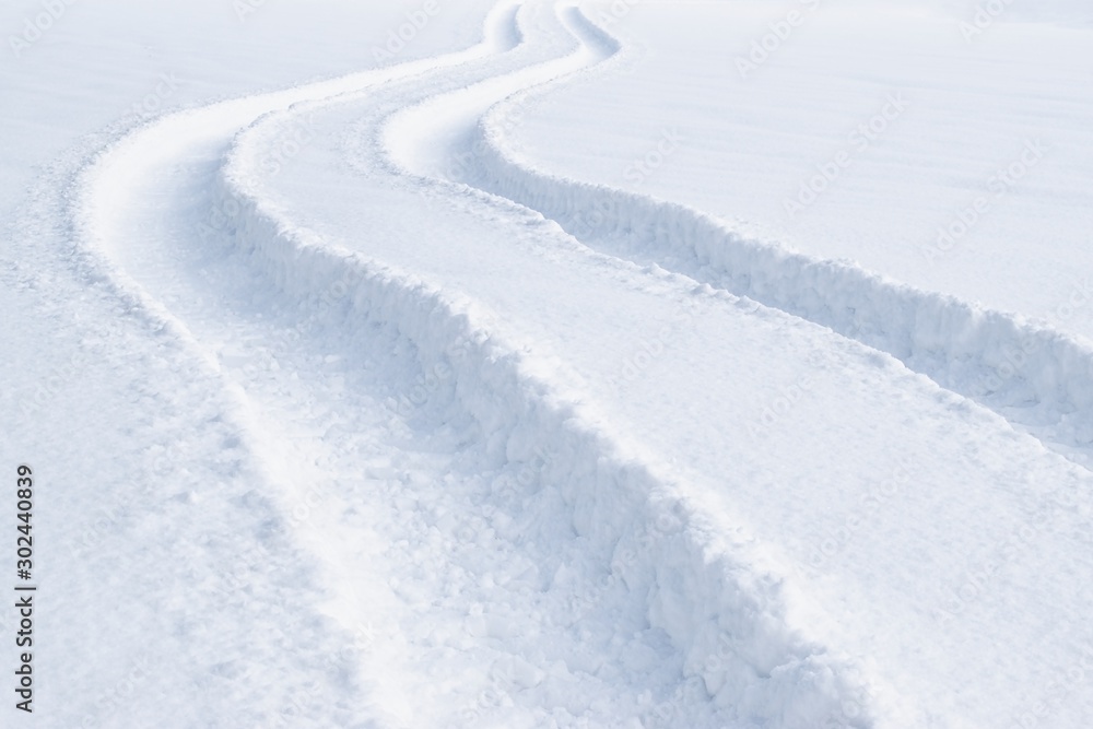 Car tracks in the deep fresh snow