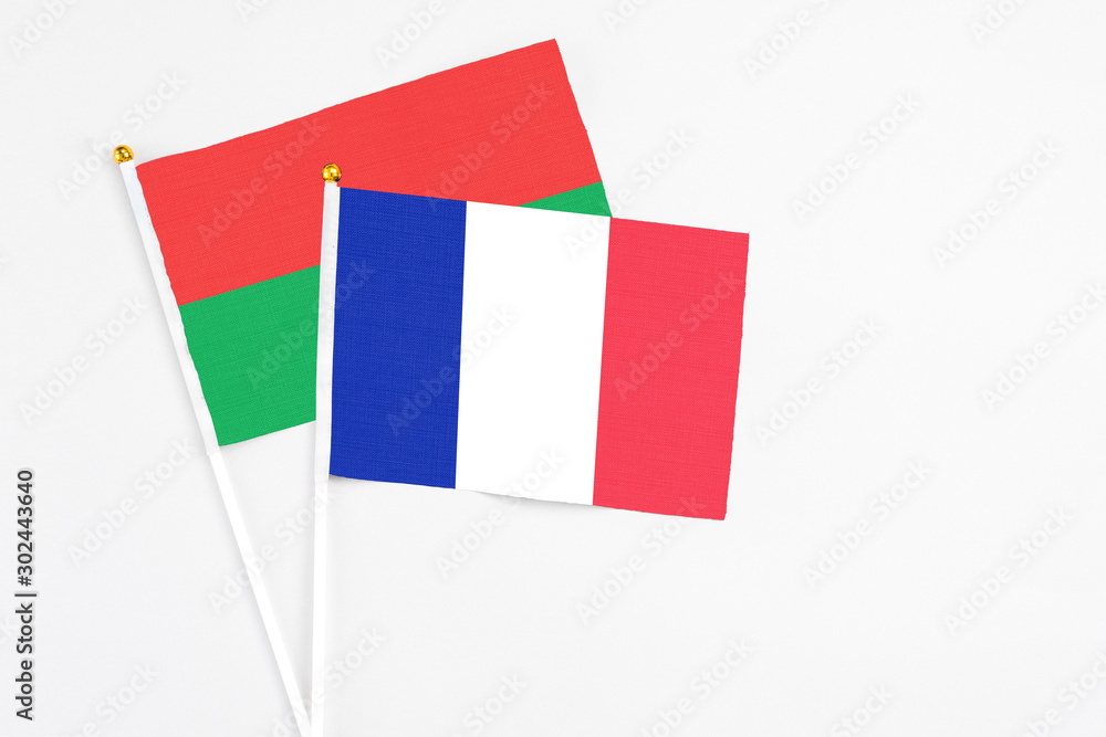 France and Burkina Faso stick flags on white background. High quality fabric, miniature national flag. Peaceful global concept.White floor for copy space. France and Burkina Faso stick flags on white background. High quality fabric, miniature national flag. Peaceful global concept.White floor for copy space.