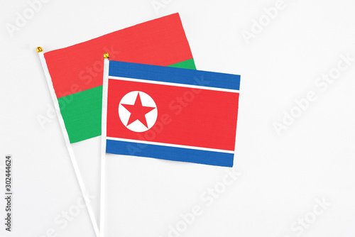 North Korea and Burkina Faso stick flags on white background. High quality fabric, miniature national flag. Peaceful global concept.White floor for copy space. Free Download North Korea and Burkina Faso stick flags on white background. High quality fabric, miniature national flag. Peaceful global concept.White floor for copy space. - GFXLoad