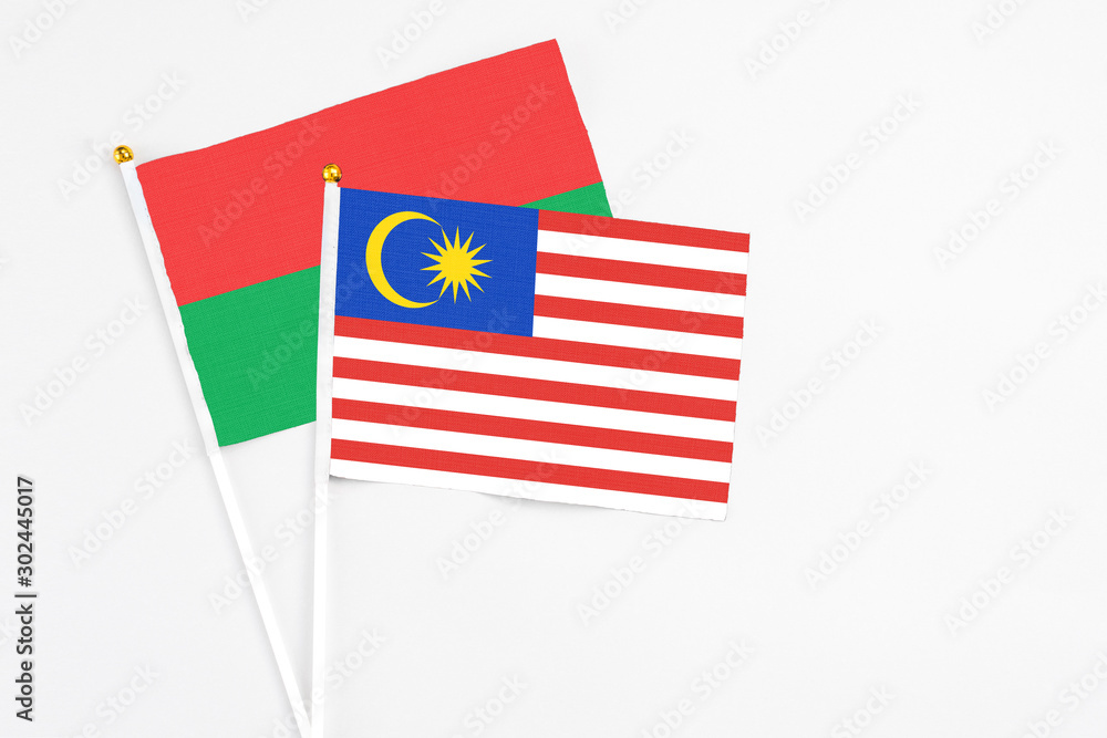 Malaysia and Burkina Faso stick flags on white background. High quality fabric, miniature national flag. Peaceful global concept.White floor for copy space. Malaysia and Burkina Faso stick flags on white background. High quality fabric, miniature national flag. Peaceful global concept.White floor for copy space.