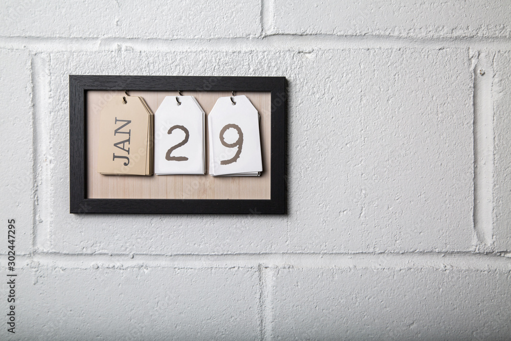 Wall Hanging Calendar in a Picture Frame Showing January 29 Wall Hanging Calendar in a Picture Frame Showing January 29