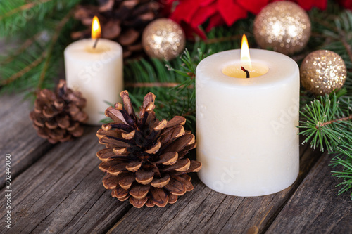 Burning Candle With Holiday Decor