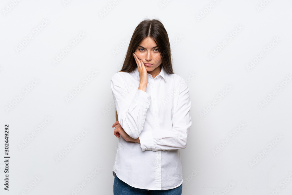 Young woman over isolated white background unhappy and frustrated Young woman over isolated white background unhappy and frustrated