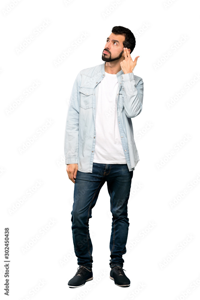 Full-length shot of Handsome man with beard with problems making suicide gesture over isolated white background Full-length shot of Handsome man with beard with problems making suicide gesture over isolated white background