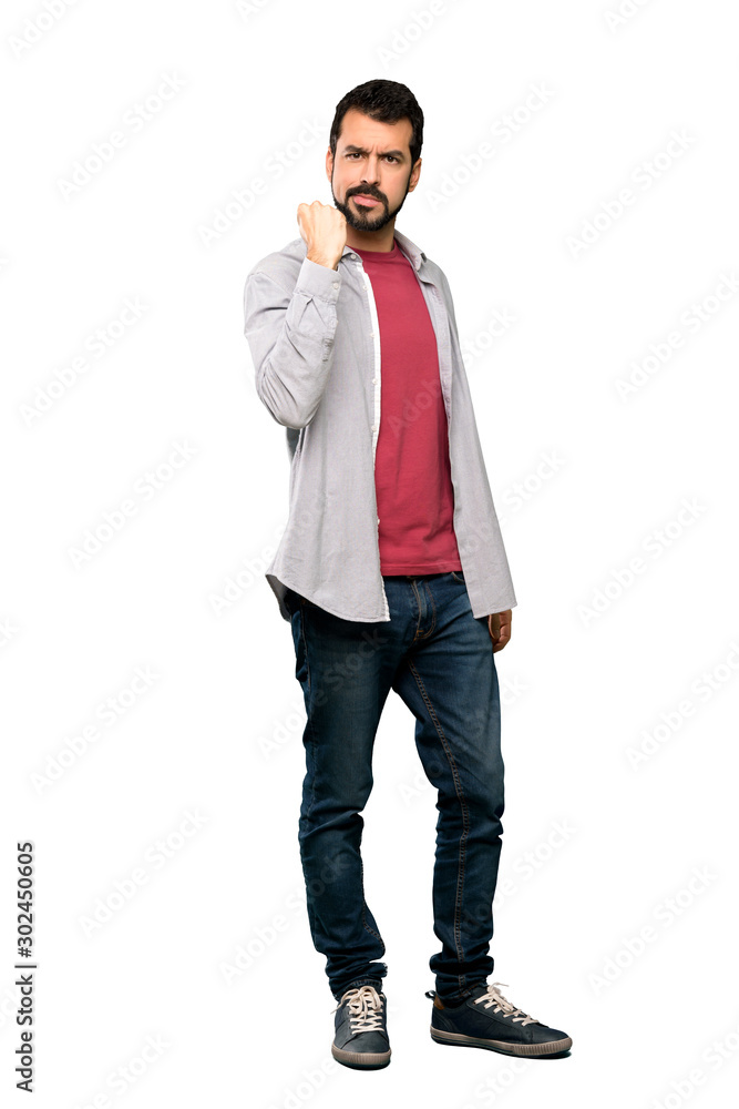 Full-length shot of Handsome man with beard with angry gesture over isolated white background Full-length shot of Handsome man with beard with angry gesture over isolated white background