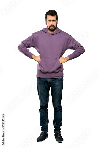 Full-length shot of Handsome man with sweatshirt angry over isolated white background