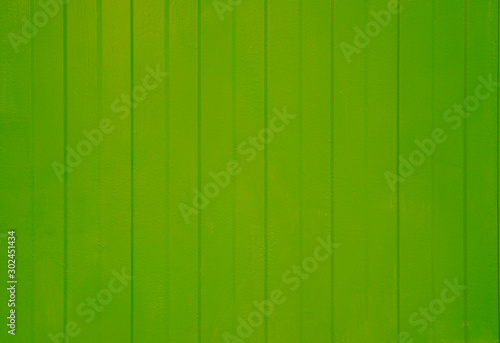 Textured background with lines pattern in green color. Sheet metal backdrop for. Lines background. Wooden backdrop with place for txt, design or copy space.