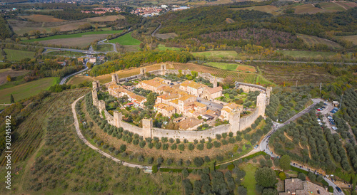 aerial close up view to medieval castle Monteriggioni in Tuscany in Italy from drone