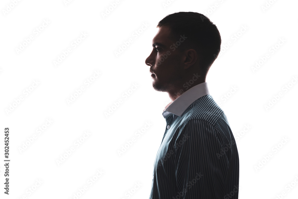 silhouette portrait of a man in profile in a business shirt isolate on white with a copy of the space - obrazy, fototapety, plakaty 
