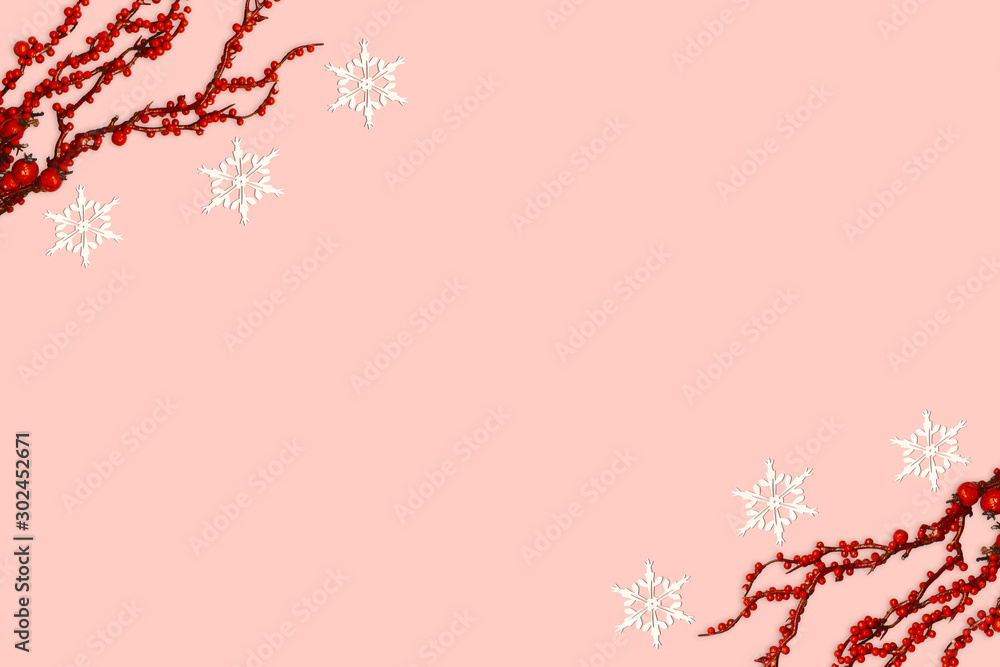 Christmas composition with red berries and snowflake on pink red background. Winter composition with copy space