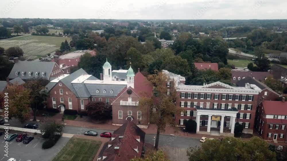 Aerial Push into Home Moravian Church in Old Salem in Winston Salem North Carolina in Fall Aerial Push into Home Moravian Church in Old Salem in Winston Salem North Carolina in Fall