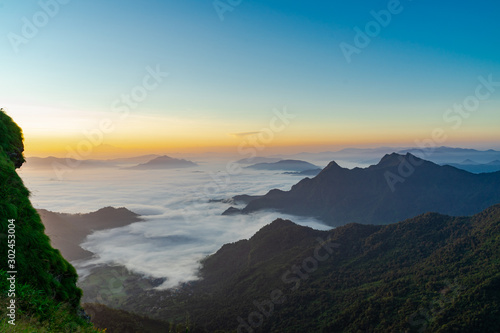 Fototapeta Naklejka Na Ścianę i Meble -  Sunrise and Mist mountain in Phu Chi Fa located in Chiang Rai, Thailand. Phu Chi Fa is the natural border between Thailand and Laos.