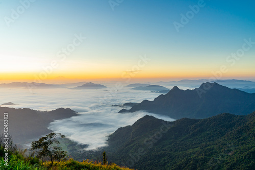 Sunrise and Mist mountain in Phu Chi Fa located in Chiang Rai  Thailand. Phu Chi Fa is the natural border between Thailand and Laos.