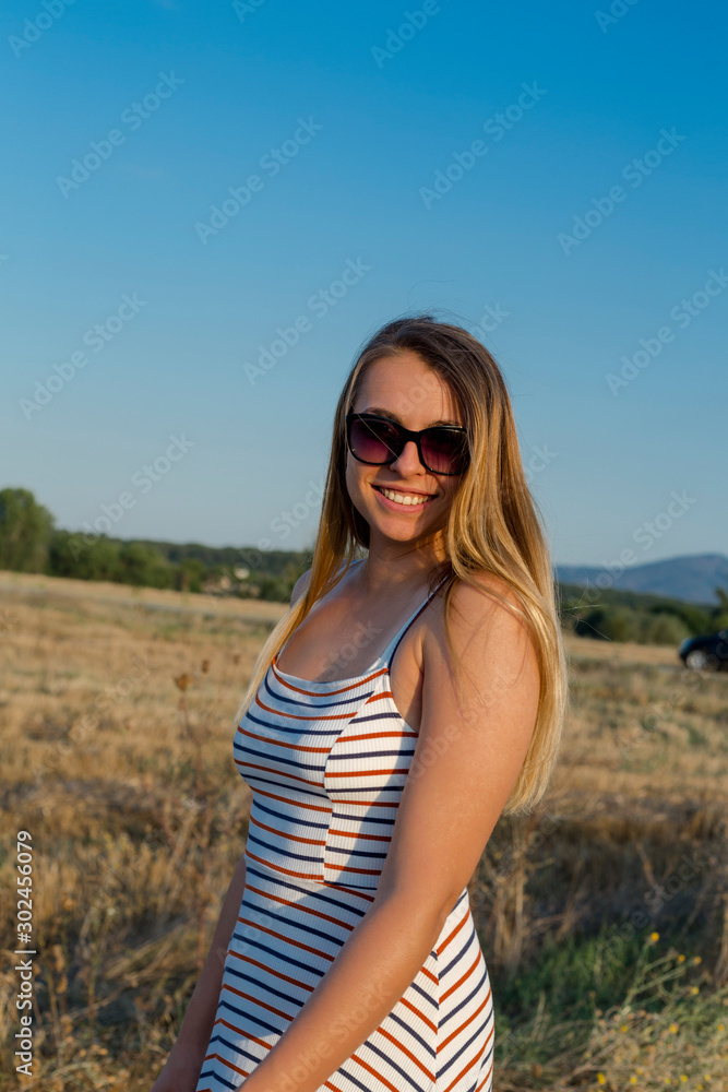 woman in the fields on sunset. Travel concept woman in the fields on sunset. Travel concept