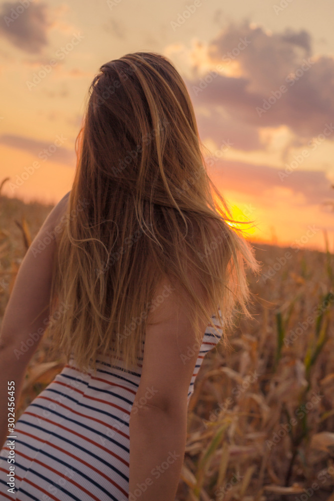 woman in the fields on sunset. Travel concept woman in the fields on sunset. Travel concept